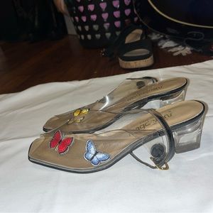 Clear and black butterfly shoes 2in heels.